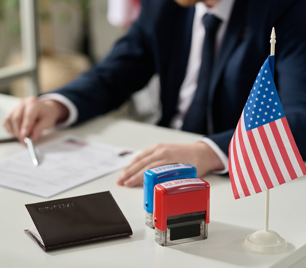 Office desk with stamps and passport